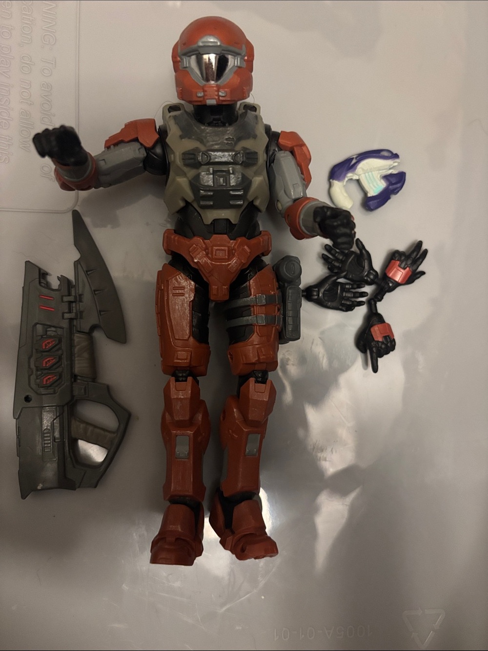 Red and Gray Interchangeable Action Figure with Weapons and Hands